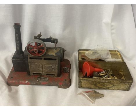 A MAMOD STATIONARY STEAM ENGINE (REQUIRES REBUILDING) AND A VINTAGE TIN CONTAINING VARIOUS PARTS AND ACCESSORIES - PISTON, FU