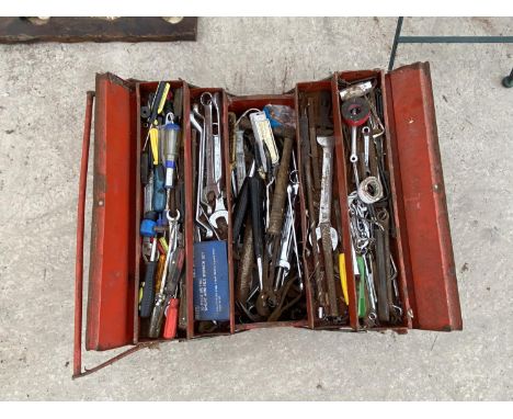 A METAL TOOL BOX WITH A LARGE ASSORTMENT OF HAND TOOLS TO INCLUDE SPANNERS, SOCKETS AND PUNCHES ETC 