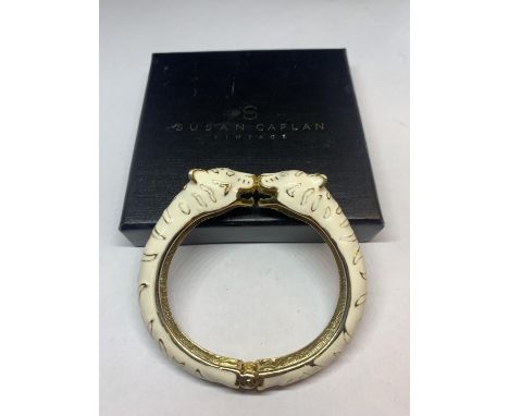 A SUSAN CAPLIN TIGER BANGLE IN CREAM AND YELLOW METAL WITH A PRESENTATION BOX 