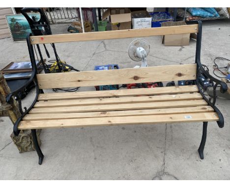 A REFURBISHED WOODEN SLATTED GARDEN BENCH WITH CAST BENCH ENDS 