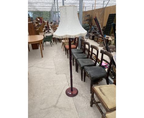 A MODERN STANDARD LAMP WITH TURNED COLUMN, COMPLETE WITH SHADE 