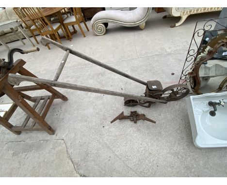 A VINTAGE GARDEN SEED DRILL 