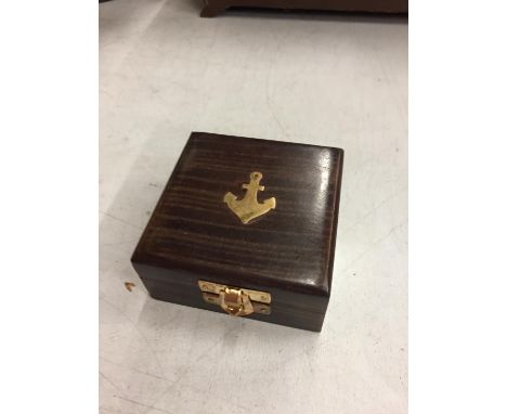 A BOXED BRASS HENRY HUGHES COMPASS 