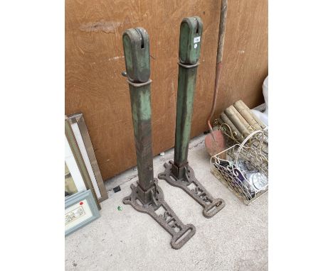 A PAIR OF VINTAGE TENNIS NET POST WITH CAST IRON 'S.I.F' BASES 