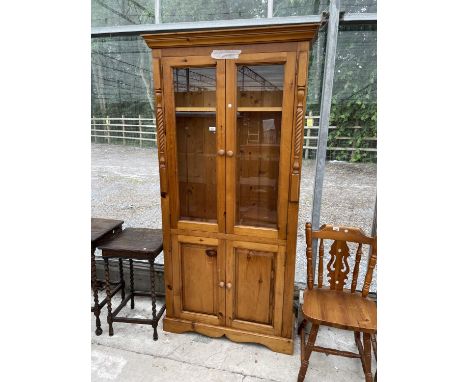 A MODERN PINE TWO DOOR GLAZED CABINET WITH CUPBOARDS TO THE BASE, 38.5" WIDE 