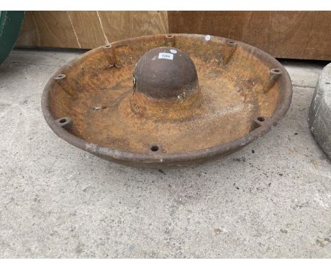 A VINTAGE CAST IRON 'MEXICAN HAT' PIG FEEDER (DIAMETER:69CM) 