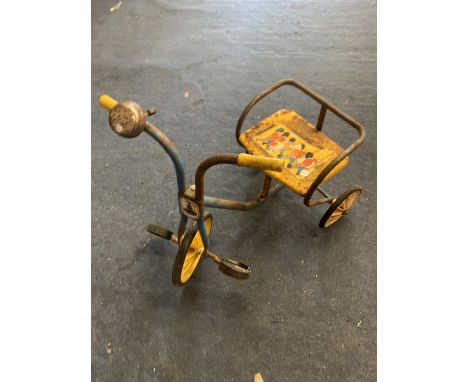 A VINTAGE TRICYCLE WITH A BUSBY BAND DECORATION 