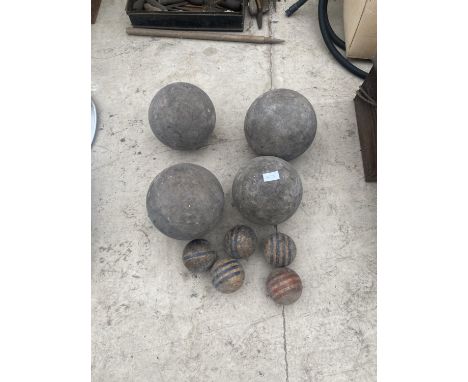 A SET OF VINTAGE WOODEN GARDEN SKITTLES 4 LARGE AND 5 SMALL 