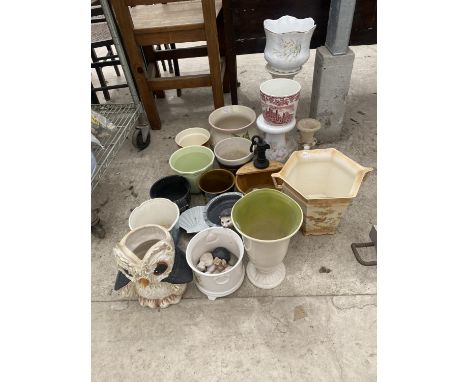 AN ASSORTMENT OF CERAMIC POTS AND PLANTERS 