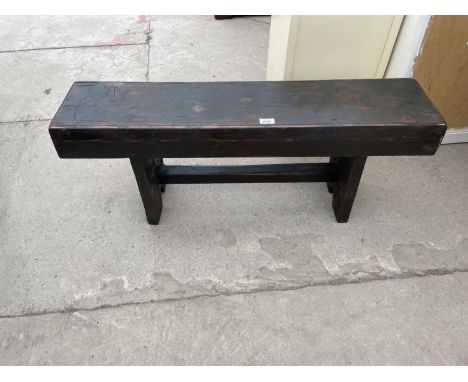 A STAINED PINE BENCH, 39.5" LONG 
