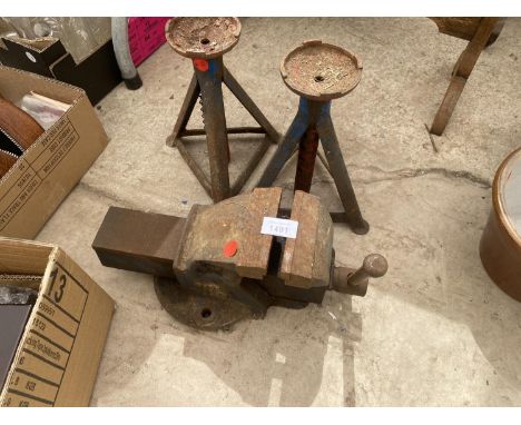 A PAIR OF AXEL STANDS AND A BENCH VICE 