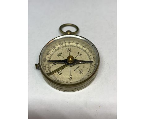 A VINTAGE BRASS COMPASS 