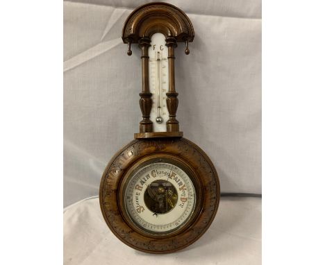 A DECORTIVE WALL BARROMETER WITH THERMOMETER A/F CRACKED GLASS ACROSS THE THERMOMETER 