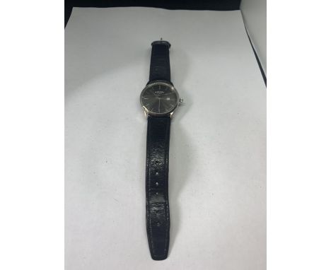 A ROTARY WATCH WITH LEATHER STRAP (FACE GLASS AND WATCH A/F) 