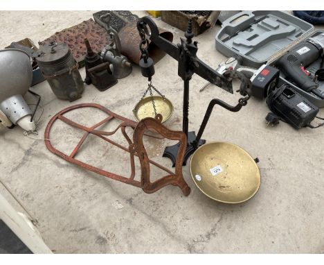 A SET OF BALANCE SCALES AND A VINTAGE SADDLE RACK 