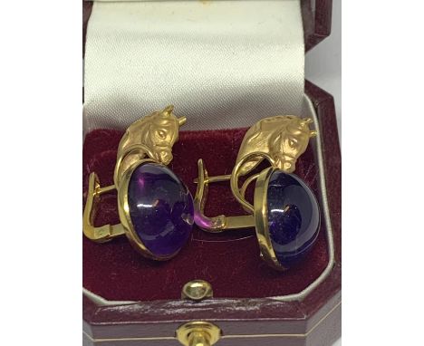 A PAIR OF 12 CARAT YELLOW GOLD HORSES HEAD  DESIGN EARRINGS WITH CABOUCHON AMETHYST  DECORATION BY LUIGI FERRARA NAPLES IN A 