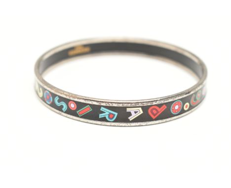 A 'HERMES' BANGLE, designed as a solid silver plated bangle with enamel alphabet and number detail, approximate width 10mm, s