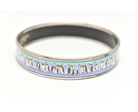 A 'HERMES' BANGLE, designed as a solid silver plated bangle with repeating enamel penguin detail, approximate width 14mm, sig
