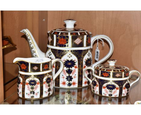 A PARTIAL ROYAL CROWN DERBY OLD IMARI TEA SERVICE in pattern 1128 comprising a coffee pot with a cypher date stamp LVIII (199