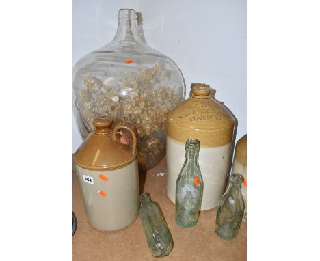 A GROUP OF LARGE VINTAGE DECORATIVE ITEMS comprising a glass demi-john style terrarium of dried flowers, approximate height 6