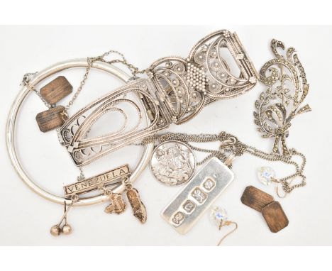 A SELECTION OF SILVER AND WHITE METAL JEWELLERY, to include a floral marcasite brooch, a hollow bangle, a pair of engine turn