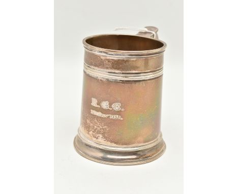 AN EARLY 20TH CENTURY SILVER TANKARD, engraved 'R.G.C 16th July 1938', fitted with a scroll handle, hallmarked 'Stokes &amp; 