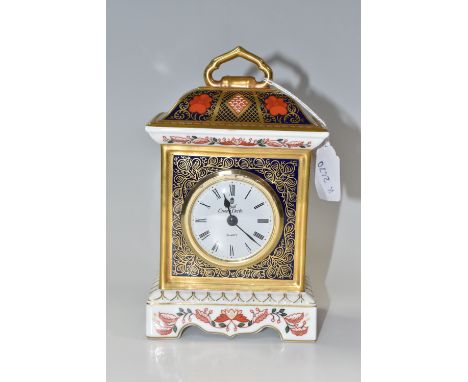 A ROYAL CROWN DERBY OLD IMARI SOLID GOLD BAND CARRIAGE CLOCK in pattern number 1128 dated 1996 LIX, fitted with a Royal Crown