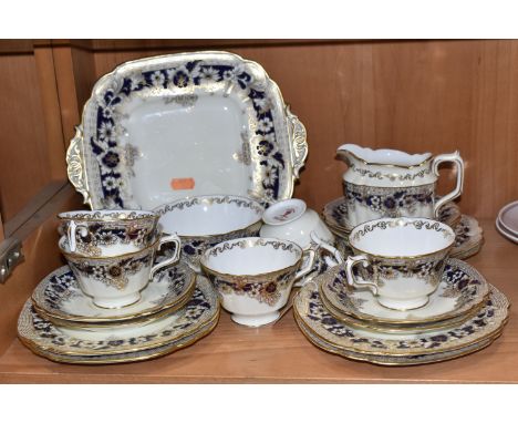 A COBALT BLUE AND GILT ROYAL CROWN DERBY TEA SERVICE comprising six tea cups (one with a hairline crack), six saucers, six si