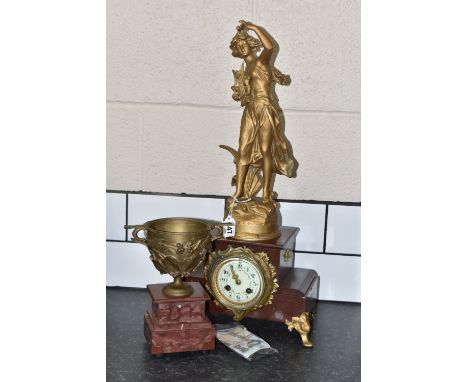 A FRENCH FIGURAL ROUGE MARBLE MANTEL CLOCK WITH A GARNITURE with pendulum and key, a female figure carrying a harp, enamelled