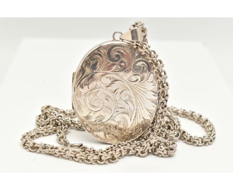 A LARGE OVAL SILVER LOCKET WITH CHAIN, foliate pattern, opens to reveal two vacant compartments, hallmarked 'F Bros' Birmingh