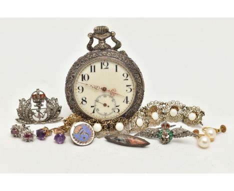 A SMALL BAG OF ITEMS, to include two white metal Royal Navy brooches both set with colourless paste and decorated with enamel