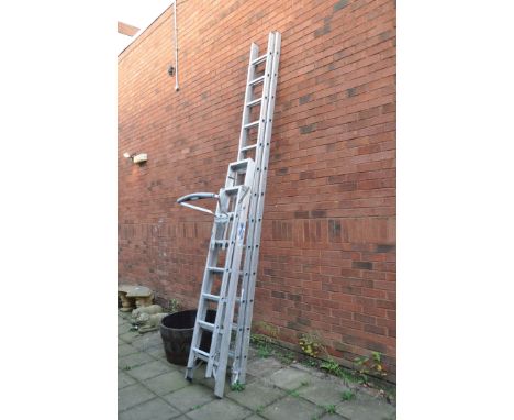 AN ALUMINIUM DOUBLE EXTENSION LADDER  by YOUNGMAN with thirteen rungs to each 350cm length along with a stand off and a step 
