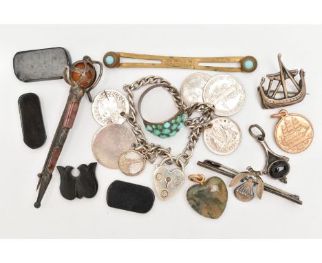 A SMALL BAG OF ASSORTED ITEMS, to include a white metal Viking ship brooch stamped 'Silver' fitted with a brooch pin and C cl