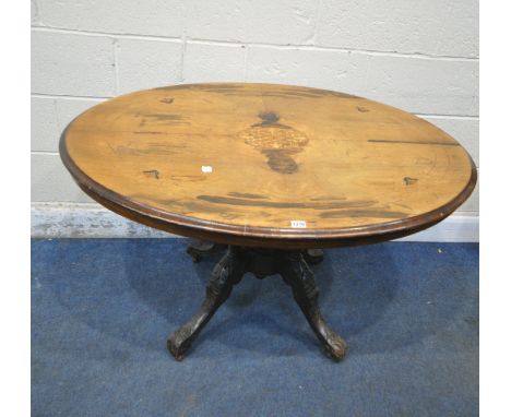 A 19TH CENTURY WALNUT LOO TABLE, with central inlay, raised on four turned supports, foliate legs, and ceramic castors, width