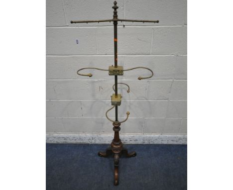 A VICTORIAN BRASS AND MAHOGANY TAPESTRY POLE SCREEN, the top rail with eight small loops, two later curved rails, raised on a