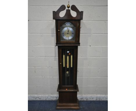A 20TH CENTURY OAK LONGCASE CLOCK, with a brass finial, the arched glass door enclosing an 8 inch brass and silvered dial, si