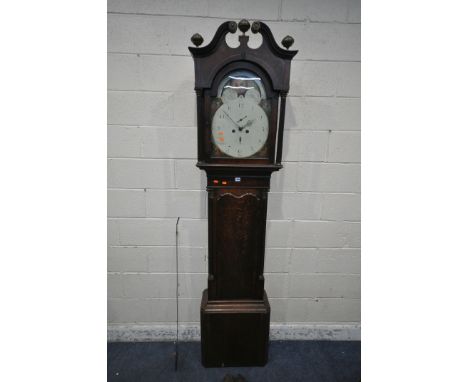A GEORGIAN OAK EIGHT DAY LONGCASE CLOCK, with twin swan neck pediment, three brass finials, twin Corinthian style pillars, fl