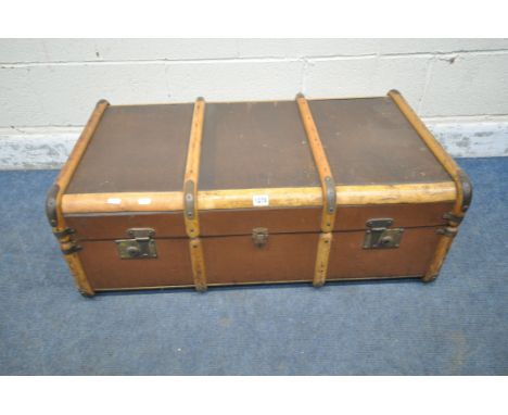 A 20TH CENTURY CANVASS AND WOODEN BANDED TRAVELING TRUNK, with twin leather handles, width 92cm x depth 54cm x height 34cm (c