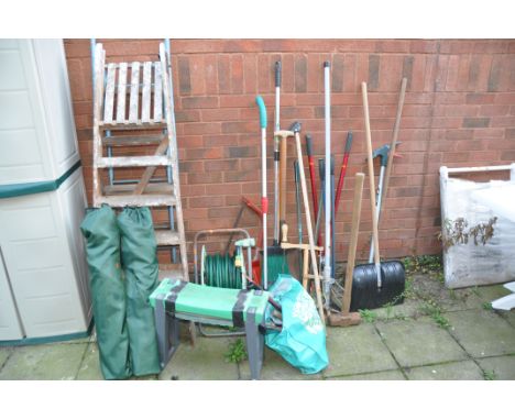 A COLLECTION OF GARDEN TOOLS AND LADDERS including two camping chairs, one wooden and one steel step ladders, hose reel, lawn