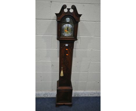 A 20TH CENTURY MAHOGANY GRANDMOTHER CLOCK, with twin swan neck pediment, the arched glass door enclosing a 6.5 brass and silv