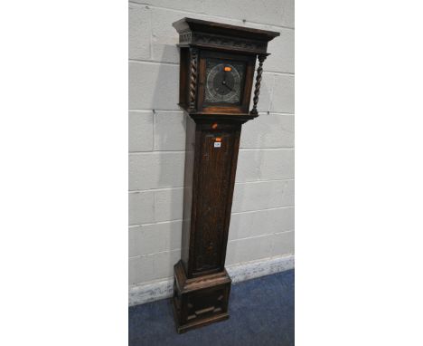 A 20TH CENTURY OAK GRANDMOTHER CLOCK, the box hood with a glass door, that's enclosing a 6.5 inch brass dial, depicting Roman