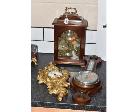 TWO CLOCKS AND A BAROMETER comprising a large mantel clock marked Stewart and 'Tempus Fugit' with roman numeral time markers,