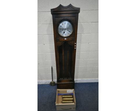 A 20TH CENTURY OAK LONGCASE CLOCK, the trunk door enclosing a 12 inch brass and silvered dial, depicting Arabic numerals, hei
