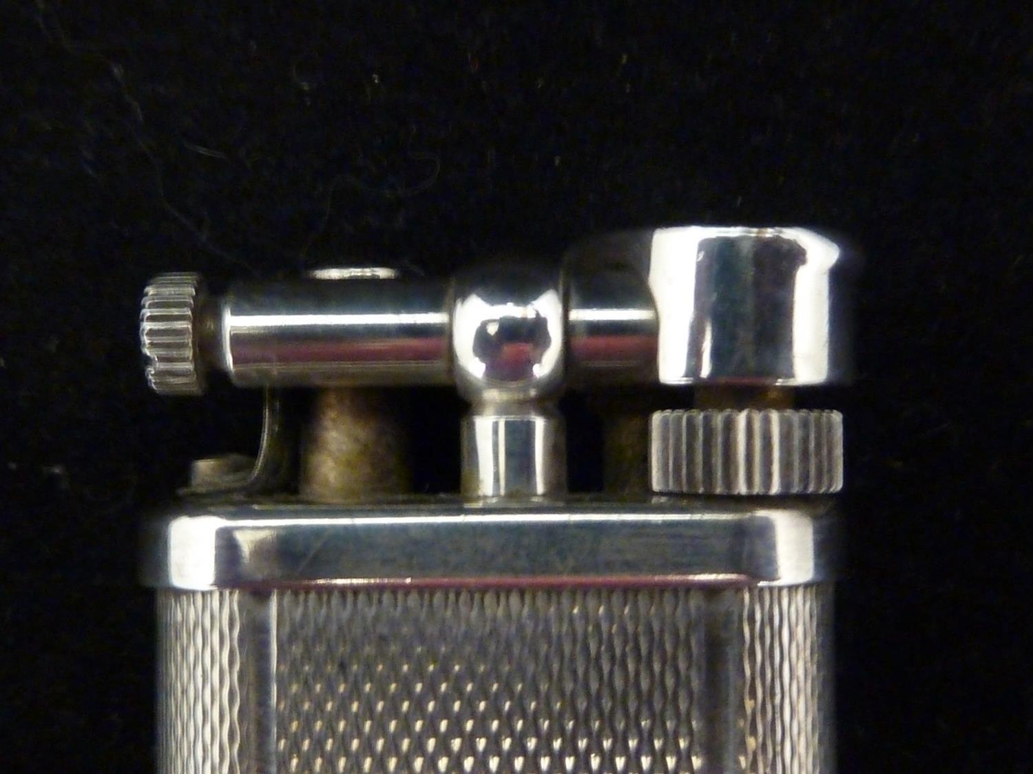 S J Dupont - A 'D line' gold finish cigarette lighter with horizontal ...