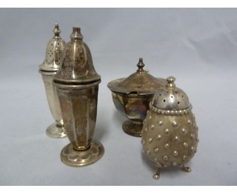 Four silver cruet items, comprising: a set of three Art Deco style with foliate paneled design, salt, pepperette and mustard 