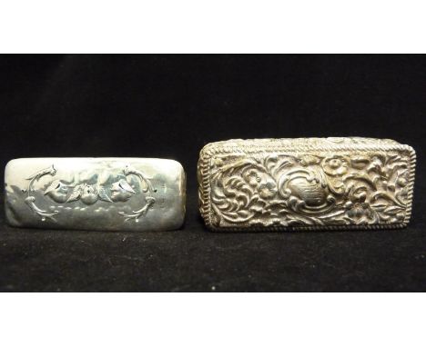 A silver snuff box, rectangular repousse decorated with scrolling foliage about a 'c' scroll reserve, Birmingham 1878, makers