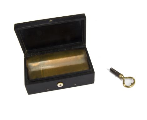 Musical snuffbox, black: playing two airs, in pressed case, the lid moulded with Paris, Colonne de la Place Vendome -- 4 1/4 
