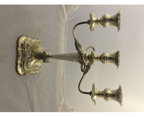 A silver three-  light candelabrum, by E. Viner, Sheffield 1954, plane column terminating in square base with foliate scroll 