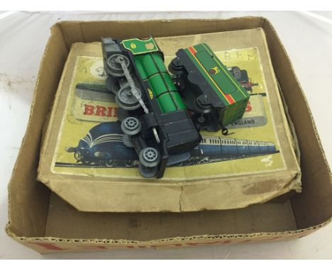 A boxed Brimtoy train set 'Cock O' The North'; together with a tinplate Eton train and tender
