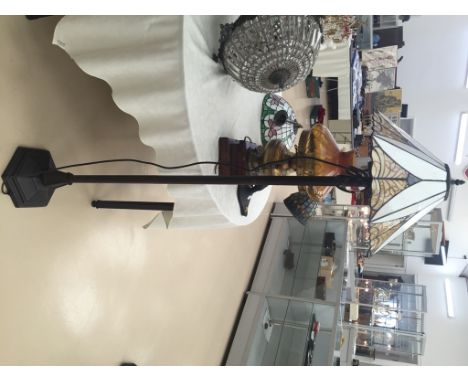 A standard lamp with Mackintosh shade